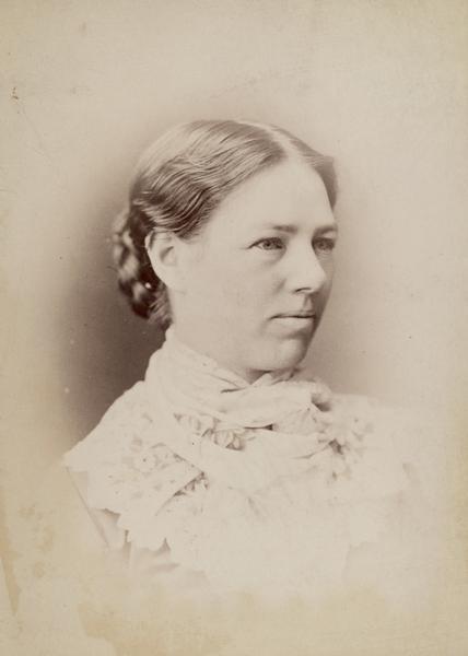 Head and shoulders studio portrait of Clara Bewick Colby.