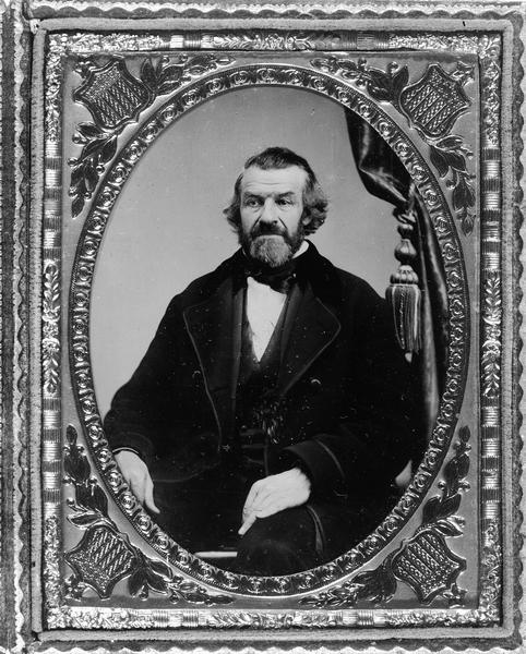 Warren P. Chase Ambrotype, studio portrait of Warren P. Chase, seated. He was a leader of the Wisconsin Phalanx at Ceresco, Wisconsin.