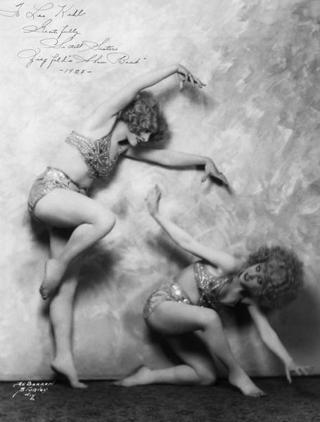 The Sidell Sisters, Billie and Pierre, former students of the Kehl School of Dance in Madison, in a posed photograph from Florenz Ziegfeld's production of <i>Show Boat</i>. They are wearing two-piece sequined, jeweled, and beaded costumes created by Mrs. Leo Kehl and by their mother.
