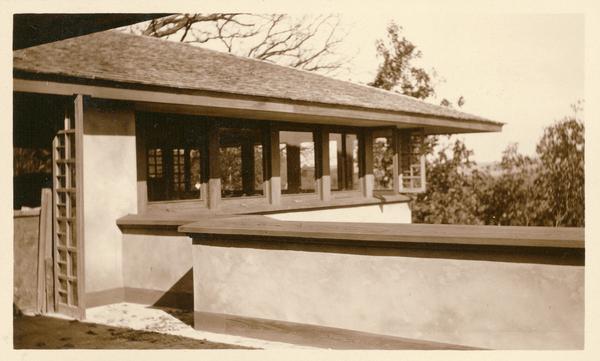 Exterior view of the eastern corner of the living room at Taliesin, probably during construction, from the terrace off the dining room. Taliesin was the home of Frank Lloyd Wright. Taliesin is located in the vicinity of Spring Green, Wisconsin.