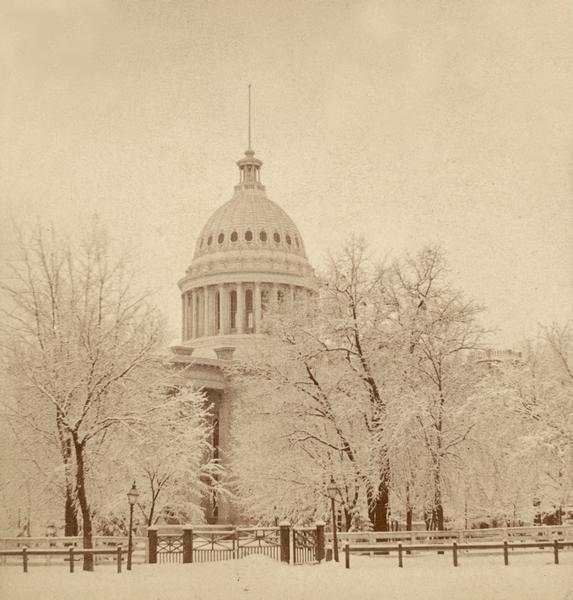 Winter view of the wooden gate to the third Wisconsin Capitol at East Washington Avenue.