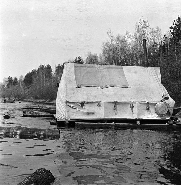 Cook's tent on a raft in the midst of a log drive on the Wisconsin  River.