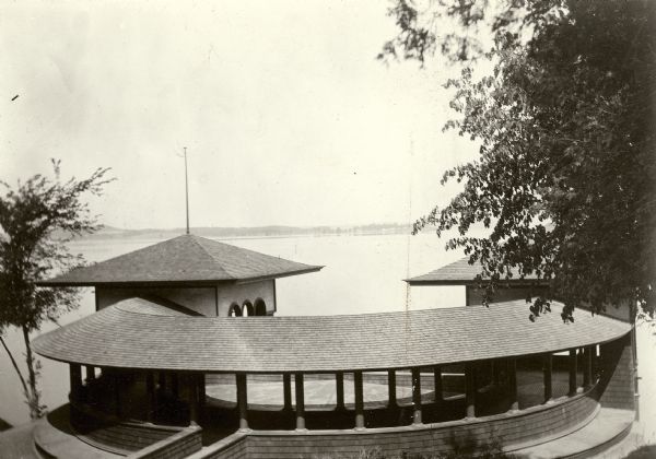 Elevated view toward Lake Mendota towards the City Boathouse, which was designed by Frank Lloyd Wright. The boathouse was at the foot of North Carroll Street. It stood from 1893 until the late 1920's.