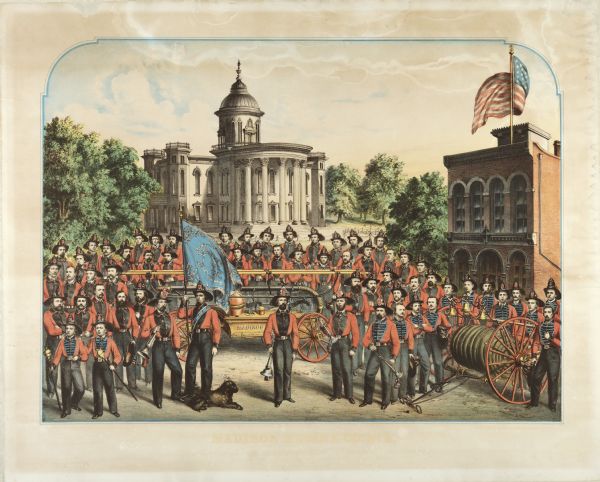 A lithographic portrait by Louis Kurz (1833-1921) of Madison Fire Engine Company #2 posed with a hand pumper and hose cart in front of the design of the new, but as yet unbuilt, Wisconsin State Capitol by architects August Kutzbock and Samuel H. Donnel. Because the new (third) Capitol was destroyed by fire in 1904, this is a somewhat ironic pairing. On the right is Station #2, 125 State Street, which was built in 1857. This building still stands although greatly altered by the Castle & Doyle Coal Co. facade.

This volunteer fire company was composed of German-American residents. The man in the central foreground is Martin Hinrichs. To his right is George Armbrecht. The first man from the left in the first row was the father of Matt Zwank of Madison. Third from the left is John Whistler, a pioneer market owner. At the extreme left in the second row from the front is Richard Baus, who operated a cigar store where the Maw-Olson store now stands. To the right of Mr. Baus is Joseph Hausmann, who was a brewer. In the fourth row back, to the left of the flag, is a man named Kessler.

One of the two torch boys in the left foreground is believed to be John B. Heim, former mayor of Madison.