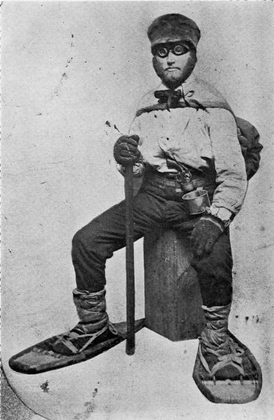 Asaph Whittlesey dressed for his journey from Ashland to Madison, Wisconsin, to take up his seat in the state legislature. Whittlesey is attired for the long trek in winter gear including goggles, a walking staff, and snowshoes.
