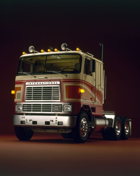International Transtar Eagle Truck Color photograph of an International Transtar Eagle semi tractor painted white with red and orange stripes, three-quarter view from front of left side.