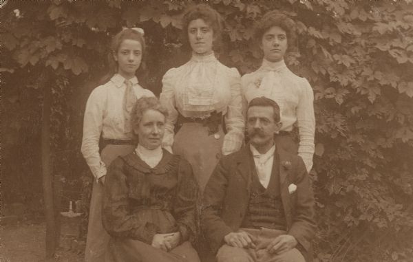 Lynn Fontanne as a girl poses with her family. Seated are Frances Ellen and Jules Pierre Antoine Fontanne. Standing left to right are Lynn, Mai, and Antoinette.