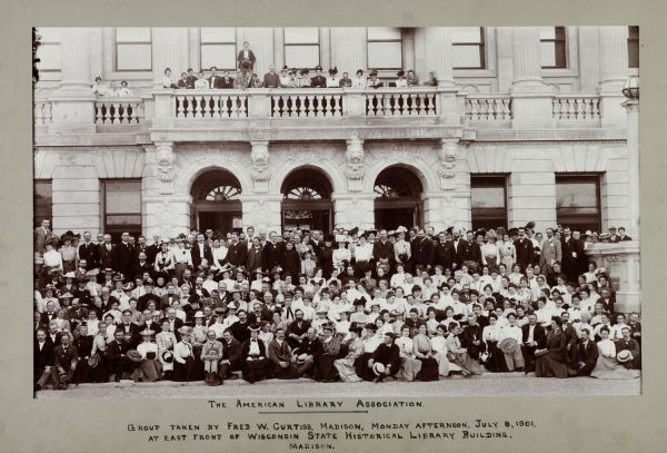 Group portrait of members of the American Library Association, Madison, Wisconsin. East front of Wisconsin State Historical Library Building. Charles A. Cutter and Reuben Gold Thwaites in front row. Others are listed in the American Library Association name file. The organizational meeting happened in Madison as a result of the desire of Thwaites to draw attention to the Historical Society's new building.