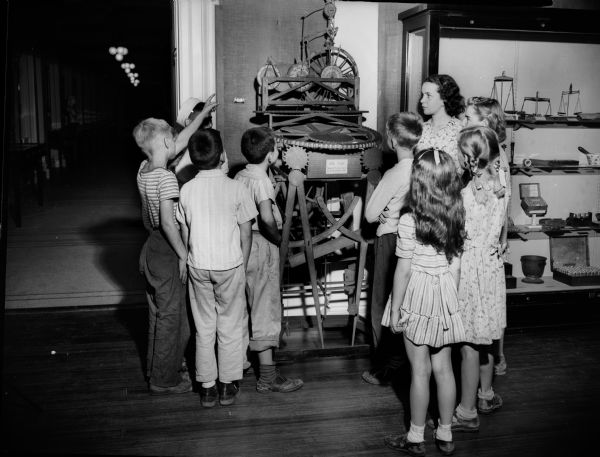 Photograph of clock made by John Muir while a student at the University of Wisconsin in 1860. Children are looking at the John Muir clock in the museum at The State Historical Society.
John Muir (1838-1914) was America's most famous and influential naturalist and conservationist. He is one of California's most important historical personalities. He has been called "The Father of our National Parks," "Wilderness Prophet," and "Citizen of the Universe."