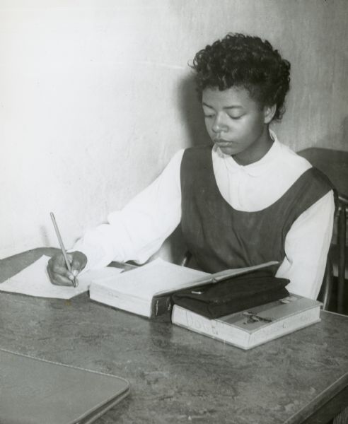 Elizabeth Eckford, one of the Little Rock Nine, doing homework.