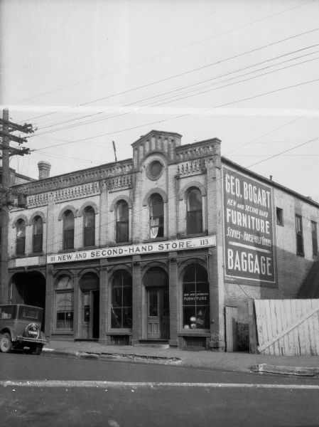 The Bogart Store, a new and second-hand store, operated by George Bogart.  Note details of the "Romanesque" brickwork, executed by Milwaukee German workmen, which are characteristic of many early Madison structures.