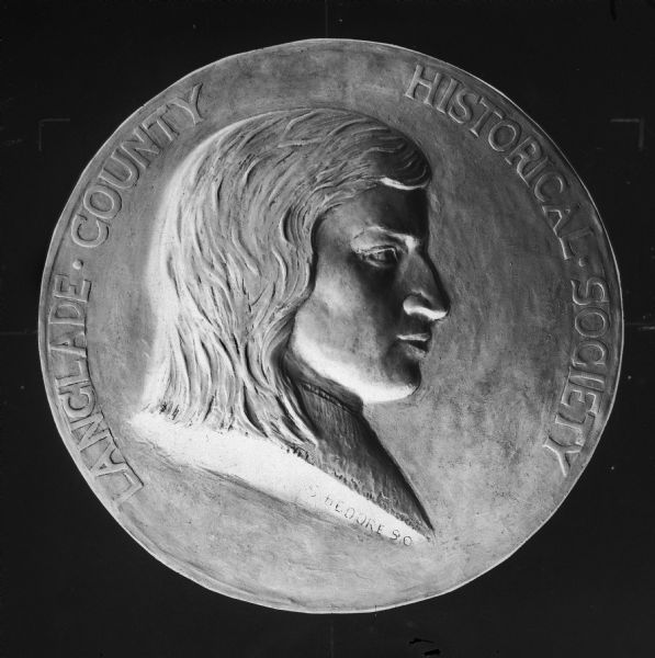 A close-up of the Langlade County Historical Society seal. It was designed by noted sculptor Sidney Bedore and bore an idealized likeness of his ancestor Charles Langlade.