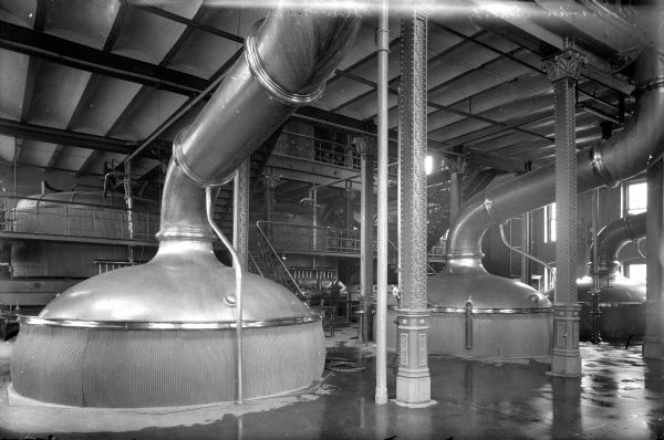 Schlitz Brew House View of the brew house of the Joseph Schlitz Brewing Company. A man can be seen standing in the background.