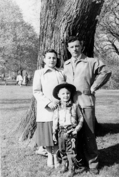 Rose and Walter Wolf Peltz with son, Andre, who is dressed up in a cowboy costume, at Lake Park.