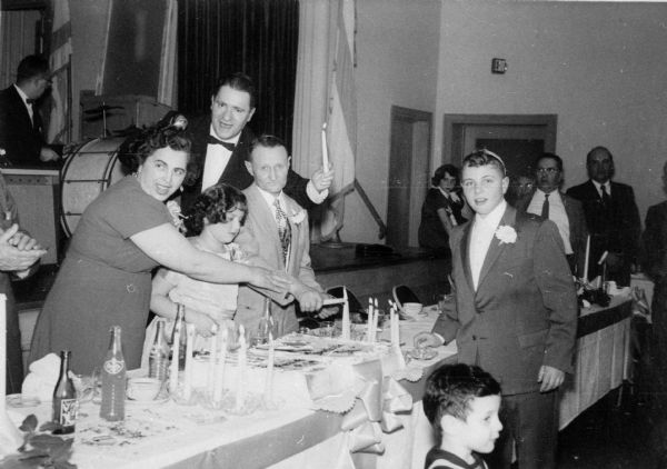 From left: Cyla Tine Stundel, daughter Golden, husband Abraham. Right (wearing suit): son Ksiel, at his Bar Mitzvah.