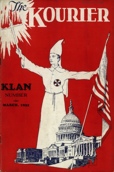 Cover design of "The Kourier" featuring a klansman wearing a conic hat and white robes, holding a burning cross in one hand and the American flag in the other. The U.S. Capitol building is in the foreground. Ku Klux Klan (KKK) monthly publication.