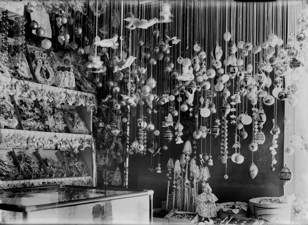 A holiday display of German-made Christmas ornaments, possibly in a store window.