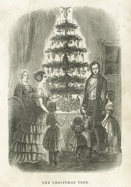 An engraving depicting a formally dressed family gathered around a Christmas tree, which is lit with candles.