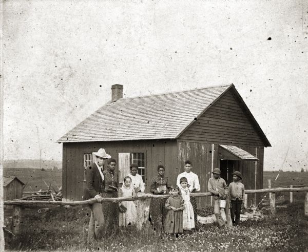 Schoolhouse of District #5 in Pleasant Ridge built on land donated by Isaac Shepard. Both blacks and whites built, attended, and taught at the school. People pictured include: F.J. Webb (teacher), Rina Gadlin, Bessie Hoffman, Nettie Gadlin, Cora Sheppard, Jennie Hoffman, May Hoffman, Emma Green, Oscar Gimes, and Lester Green.