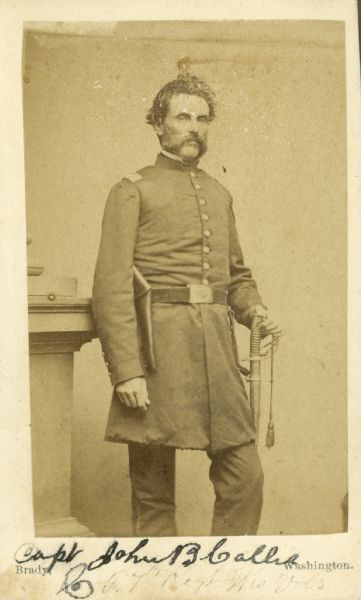 Carte-de-visite of a three-quarter length portrait of John B. Callis in uniform with a sword on his left side.