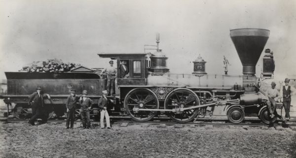 Locomotive No. 75. Class H. Built 1850 by Schnectady Locomotive Works. Men are posed on and around the locomotive.