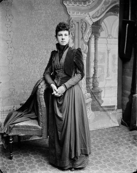 Evaline (Eva) Bennett's Wedding Portrait Wedding portrait in front of a painted backdrop of Henry H. Bennett's second wife, Evaline (Eva) Marshall Bennett.