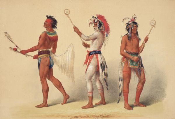 Indians with ball-playing equipment, believed to be used in  the game of Lacrosse. (Plate 21)<p>"In devoting a few of the last pages of this work to some of the principal amusements of the North American Indians, I have commenced with the beautiful game of Ball, decidedly the favorite and most exciting game of the American tribes. Amongst the forty-eight tribes which I have visited, I find the game of Ball everywhere played; and to any great surprise, by tribes separated by a space of three thousand miles, played very nearly in the same manner; the chief difference consisting in the different construction of the ball-sticks used-the modes of laying out the ground- and painting and ornamenting their bodies. In most of the tribes there are certain similar regulations as to dress, ornaments, etc., which no one is allowed to depart from; and in the three portraits given in the illustration here, these peculiar and general modes are all set forth."</p>