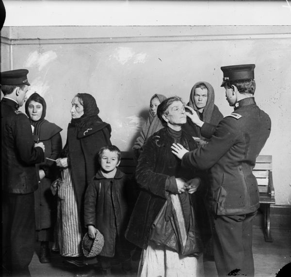 Medical inspection of immigrants at Ellis Island.