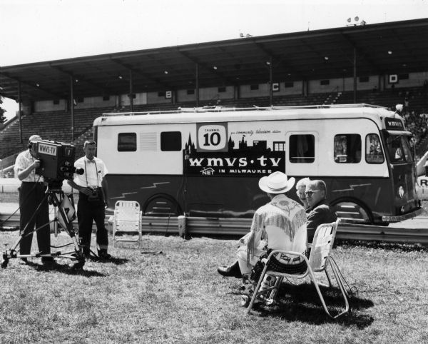 The operators of the mobile unit of WMVS-TV, a community station out of Milwaukee Vocational and Adult Schools, film an interview with Roy Rogers and Dale Evans during the Wisconsin State Fair.