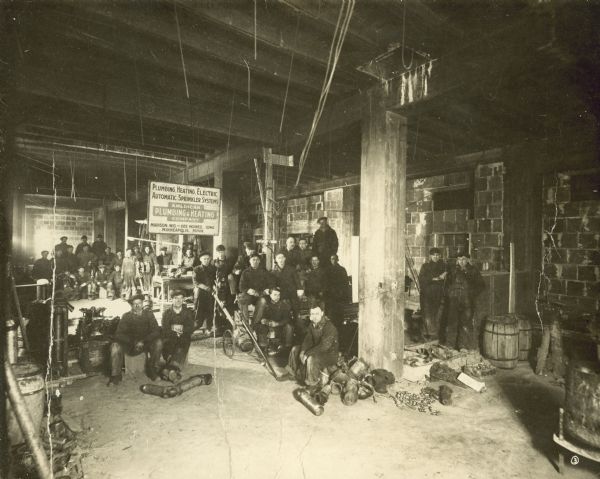 American Plumbing & Heating Company A group portrait of workers in the American Plumbing & Heating Company.
