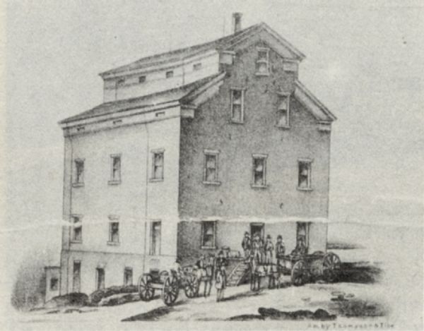 Drawing of the exterior of the Shopiere Flouring Mill. Several men, some in a horse-drawn wagon are in front of the building.