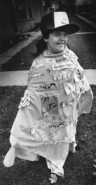 Amanda Basile of Milwaukee's Northwest side dressed as the Milwaukee Journal Green Sheet for Halloween. She made the costume with her mother Penny Chapman by dying a sheet green and fastening green sheet articles to it. She is also wearing a Green Sheet cap.