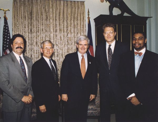 Steve Gunderson and Newt Gingrich Steve Gunderson, Newt Gingrich (center) and three other men pose together in an office.