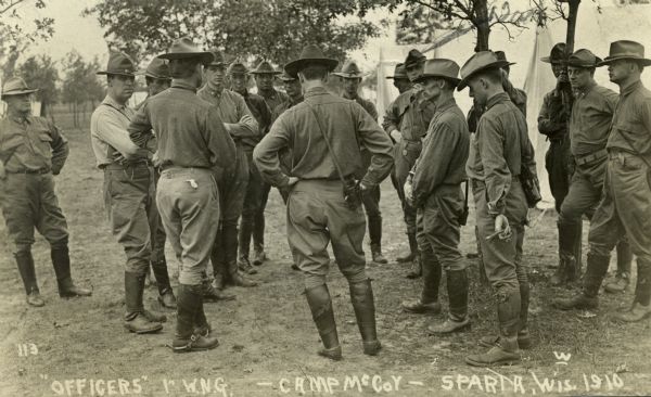 Assembled group of Wisconsin National Guard officers at Camp McCoy. A few tents can be seen in the background at right.