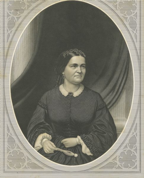 Portrait of Mrs. Abraham Lincoln in a dark-colored dress, hair in ringlets with a jeweled hair band, and holding a fan; engraved by Samuel Sartain, and printed by Irwin & Sartain.
