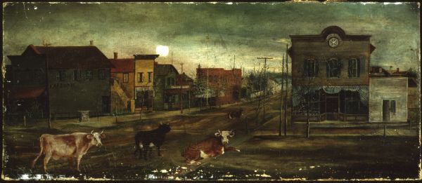 Main Street in Bayfield in 1870 with four cows standing in the street.
