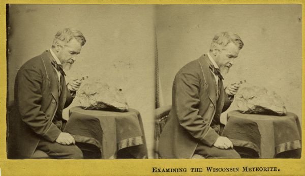 Stereograph of Increase Lapham examining a fragment of a meteorite.
