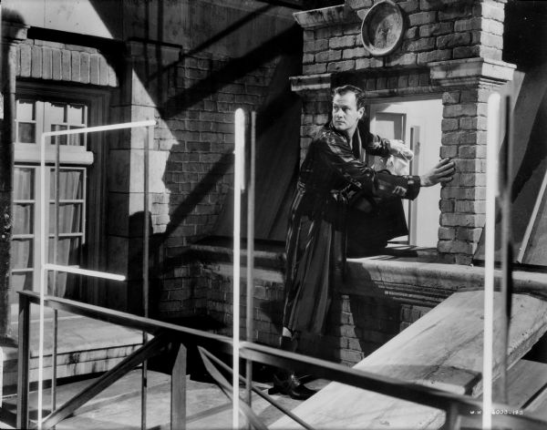 Joel McCrea in "Foreign Correspondent" In this scene still from the film "Foreign Correspondent," Joel McCrea, wearing a dressing gown, prepares to climb out a window.