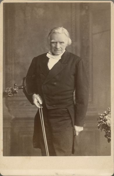 World-renowned Norwegian violinist Ole Bull shown here with his violin under his arm. Bull was good friends with University of Wisconsin Professor Rasmus Anderson and produced several concerts to benefit the university's new Scandinavian studies program.