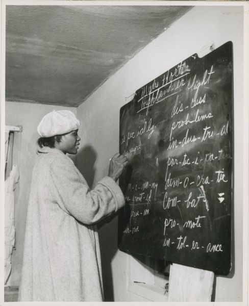 A woman writing on a chalkboard as part of the Citizenship School on Johns Island.