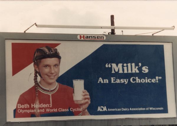 Beth Heiden Billboard American Dairy Association of Wisconsin billboard featuring Olympian, Beth Heiden, in cycling gear and holding a glass of milk.