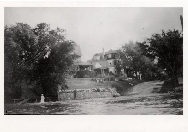 Frederick Jackson Turner Residence View from Lake Mendota of the Turner residence at 629 Frances Street. A woman is standing on the shoreline.