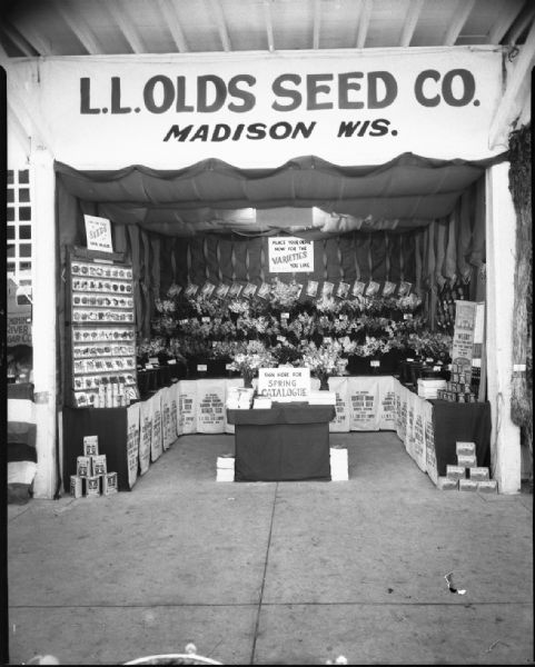 L.L. Olds Seed Company display booth of flowers and seeds at Wisconsin State Fair.
