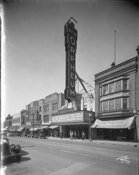 Orpheum Theatre, 216 State Street. View includes Speths Clothing, Weber's Restaurant, Family Shoe Store, Rentschler Floral Co. Featured photoplay is "Wolf's Clothing."