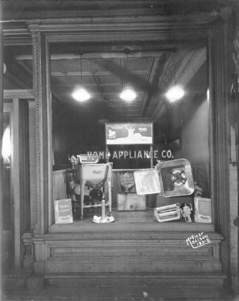 Home Appliance Co. window display of a Maytag washing machine, at 120 E. Main Street.