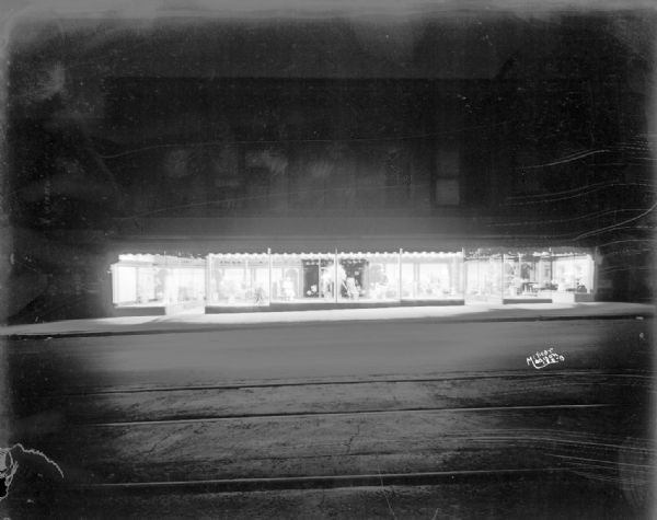 View across street towards the Baron Brothers, Inc. Department Store window display, at 12-18 W. Mifflin Street.