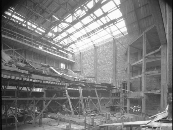 An interior view of the Capitol Theatre as it is being built at 211 State Street, as viewed from the stage toward the balcony.