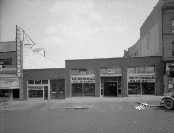 Gillespie Motor Sales Company, with used car building, 207 E. Washington Avenue.