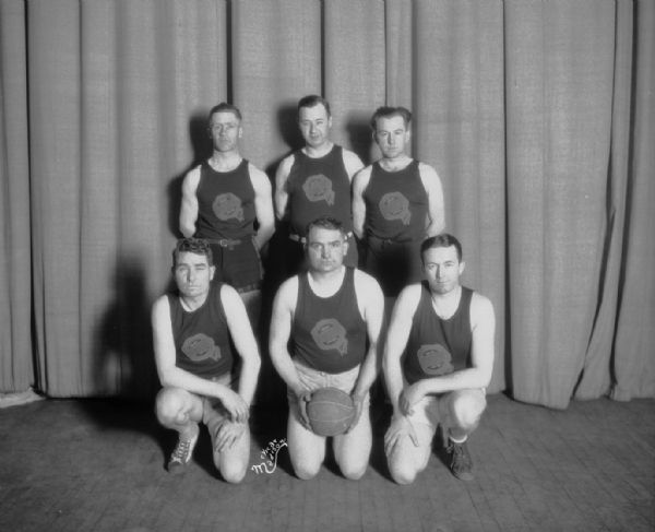 Gillespie Motor Sales men's volleyball team, with three men standing and  three men kneeling.