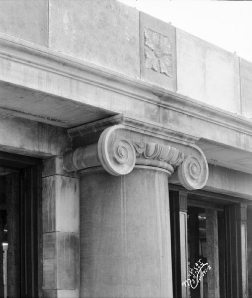 U.S. Post Office, with a close-up view of stone carving on a column capitol with a rosette over it, at 215 Monona Avenue. (Martin L. King Jr. Boulevard.)